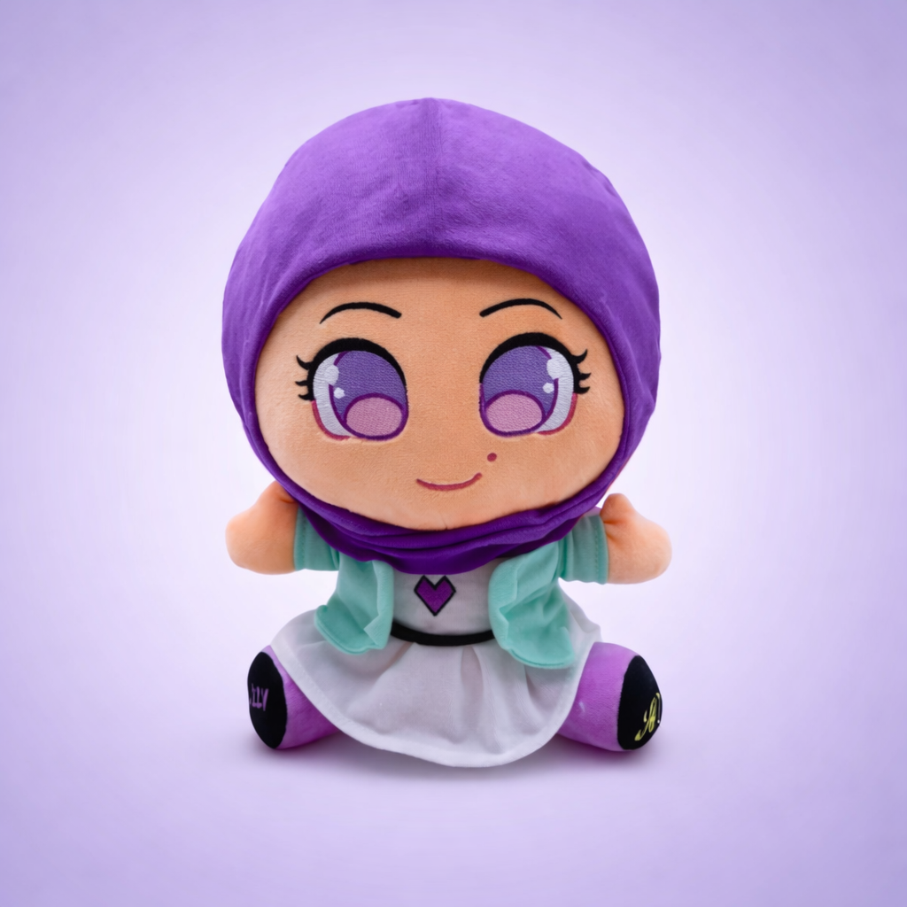Cute plush doll wearing a purple hijab and colorful outfit, smiling with big eyes.
