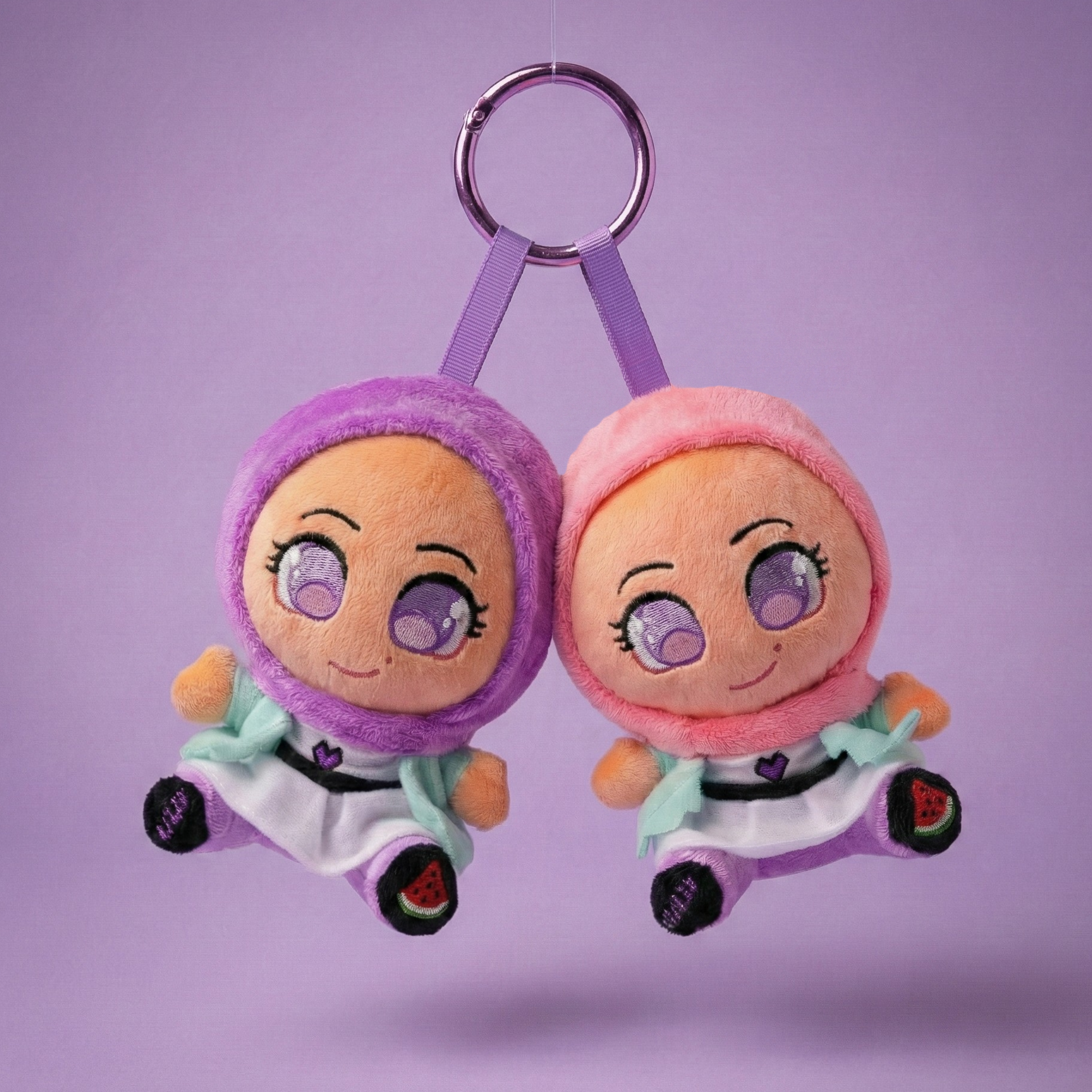 Cute plush doll wearing a purple hijab and colorful outfit, smiling with big eyes.