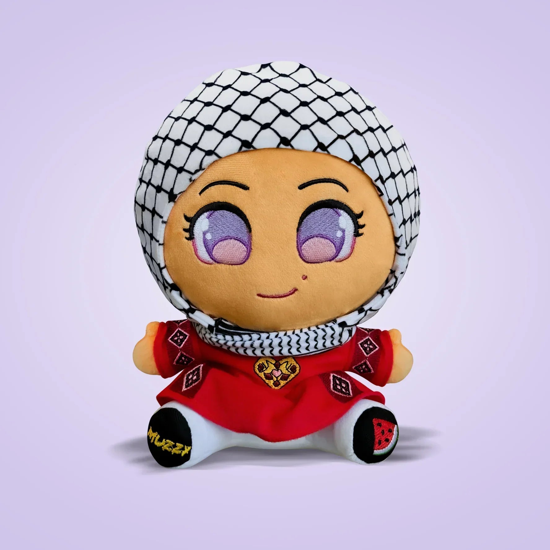 Cute plush doll wearing a purple hijab and colorful outfit, smiling with big eyes.