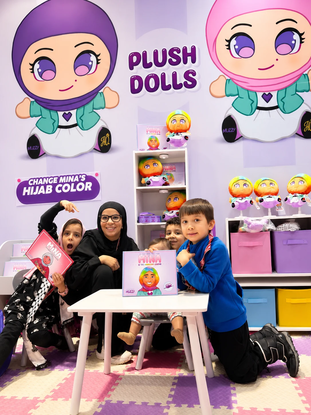 Muzzy event booth with children and families